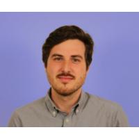 Headshot photo of Stephen Larrick with a purple background