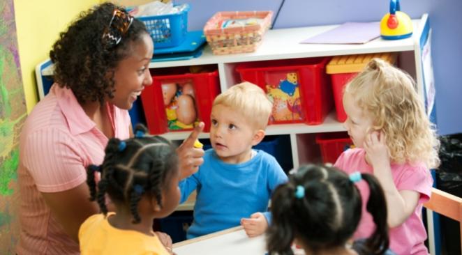 Caregiver with children at daycare