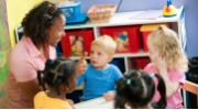 Caregiver with children at daycare